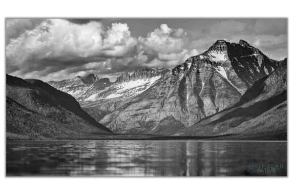 McDonald lake in Glacier National park with Kayakers, photo by Jeret Lockhart